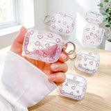 Yeknu  Minimalist red hollow heart-shaped transparent TPU shell shock-absorbing headphone cover with metal keychain