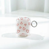 Yeknu  Minimalist red hollow heart-shaped transparent TPU shell shock-absorbing headphone cover with metal keychain