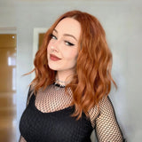 Yeknu  Short Wavy Curly Bob Wigs for Women Ginger Orange Shoulder Length Middle Part Copper Natural Wave Heat Resistant Cosplay Party