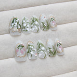 Yeknu  24Pcs Press On Nails Lily of the Valley&Tulip Floral Almond Fake Nails with Pearl&Rhinestone Accents Reusable False Nails