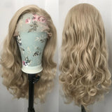 Yeknu  Long Curly Wavy Ash Blonde Synthetic Hair Free part Loose Body Wave Strawberry Blonde 13X4 Lace Front Wigs for Women Daily Party