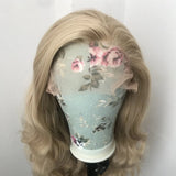 Yeknu  Long Curly Wavy Ash Blonde Synthetic Hair Free part Loose Body Wave Strawberry Blonde 13X4 Lace Front Wigs for Women Daily Party