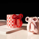 Yeknu 1Pc Bow Handle Heart Ceramic Mug, Creative Bow Handle Design Checkerboard Pattern Mug Coffee Cup, Suitable for Home Decoration, Daily Drinking Water, Breakfast Milk, Afternoon Tea Coffee, Coffee Shop Latte Flower Cup, E